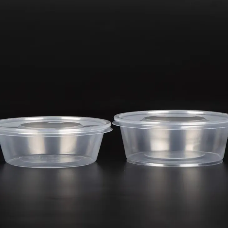 Ids াকনা সহ প্লাস্টিকের বৃত্তাকার বাটি